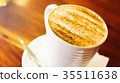cappuccino cup on the brown wooden table 35511638