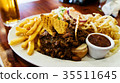 Unhealthy meal with mexican nacho chips loaded 35511645