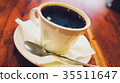Black coffee in white cup on the brown wooden 35511647
