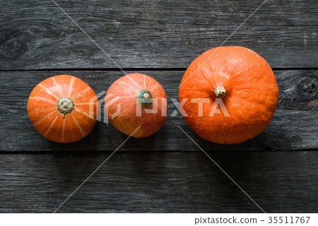 Pumpkin on old wooden table 35511767
