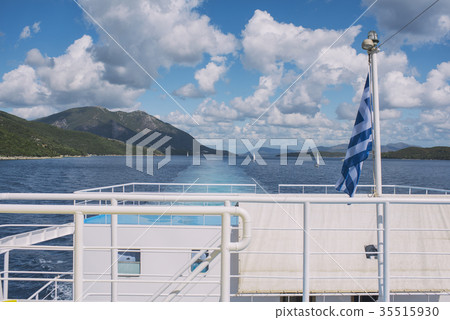 The Greek flag on the ship against the islands The Greek flag on the ship against the islands 35515930