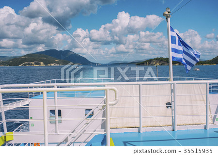 The Greek flag on the ship against the islands The Greek flag on the ship against the islands 35515935