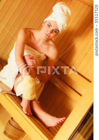 woman relaxing in wooden sauna room 35517320