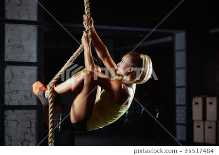 Female crossfit athlete exercising Female crossfit athlete exercising 35517484