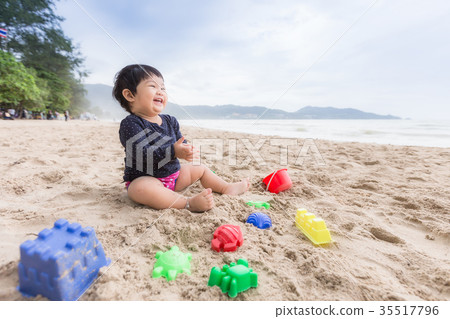 Asian cute girl smiling and happy on the beach. 35517796