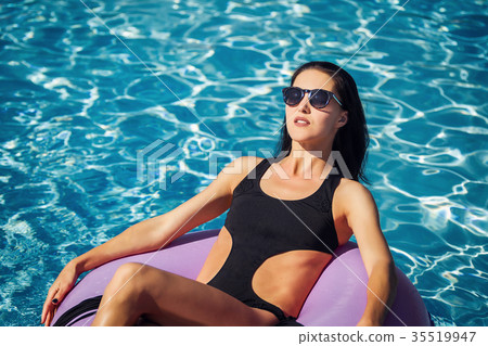 beautiful woman in bikini in the swimming pool beautiful woman in bikini in the swimming pool 35519947
