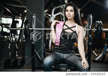 Sexy athletic young girl working out in gym Sexy athletic young girl working out in gym 35520337