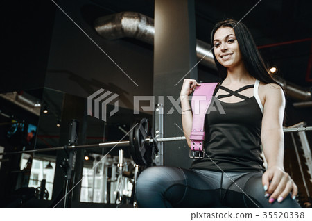 Handsome model young man working out in gym 35520338