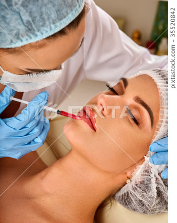 Dermal fillers lips of woman in spa salon with Dermal fillers lips of woman in spa salon with 35520842