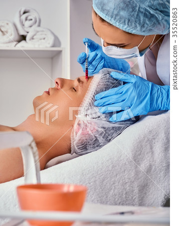 Filler injection for male face. Plastic facial Filler injection for male face. Plastic facial 35520863