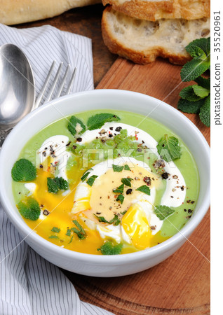 Pea puree soup with poached egg and peppermint Pea puree soup with poached egg and peppermint 35520961