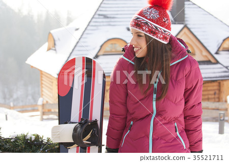 winter, leisure, sport and people concept - happy young woman in 35521711
