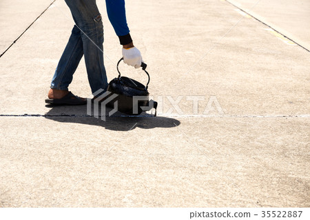 Worker is pouring asphalt for road repair Worker is pouring asphalt for road repair 35522887