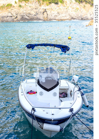 Little motor boat with objects parked in Monteross Little motor boat with objects parked in Monteross 35525525