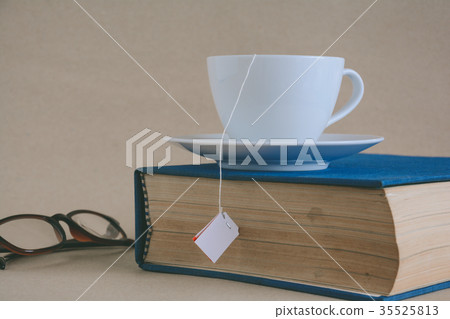 Book glasses and tea on the desk with study 35525813