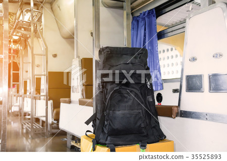 Black luggage on a chair 35525893