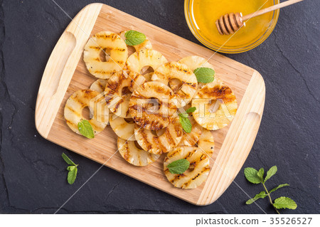 Grilled pineapple with honey Grilled pineapple with honey 35526527
