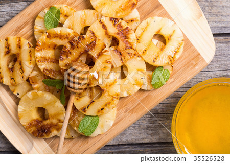 Grilled pineapple with honey Grilled pineapple with honey 35526528