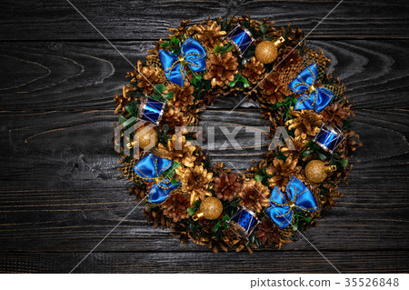 Christmas wreath on wooden background 35526848