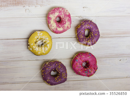 Ring of Fresh donuts with colorful glaze  35526850
