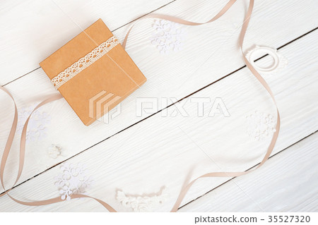 Christmas box with kraft paper and ribbon, mockup Christmas box with kraft paper and ribbon, mockup 35527320