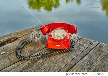 Old telephone in nature 35528453