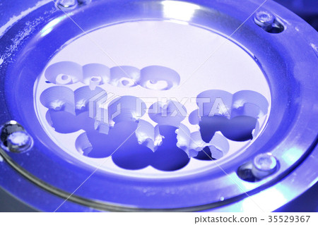 Dental milling machine carving out shape of human 35529367