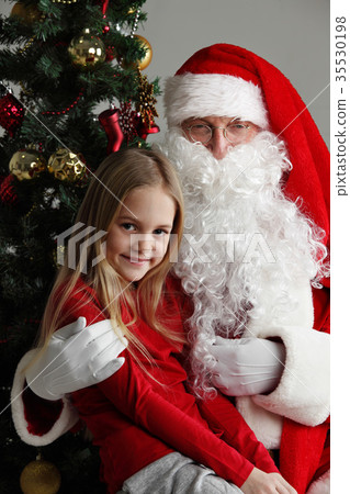 Girl on santa claus knees Girl on santa claus knees 35530198