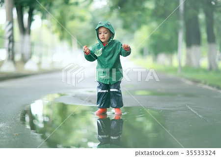 cold summer walk in the rain little girl puddles cold summer walk in the rain little girl puddles 35533324