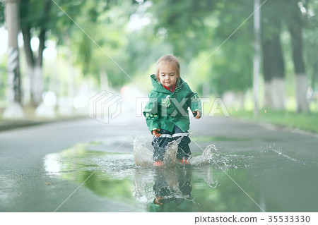 cold summer walk in the rain little girl puddles cold summer walk in the rain little girl puddles 35533330