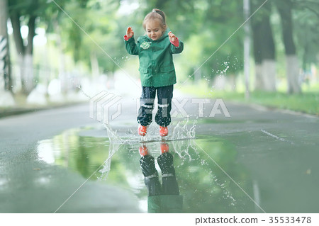 cold summer walk in the rain little girl puddles cold summer walk in the rain little girl puddles 35533478