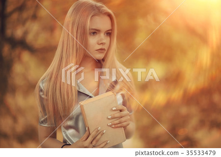 Young girl in autumn portrait, blond adult 35533479