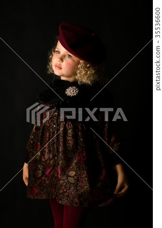 Pretty girl in brown old-fashioned costume 35536600