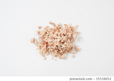 Cooked brown rice on white table 35538052