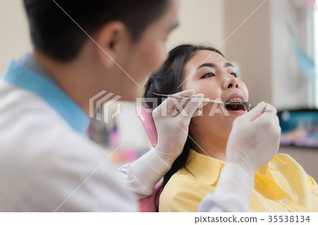 Female patient with dental checkup Female patient with dental checkup 35538134