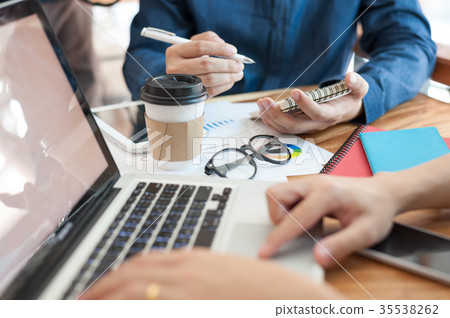 Young worker working with colleague 35538262