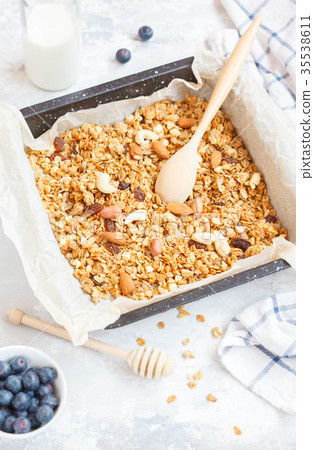 Baked oats granola with nuts and honey. Baked oats granola with nuts and honey. 35538611