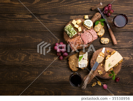 Assorted cheeses on wooden board Assorted cheeses on wooden board 35538956
