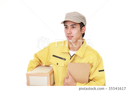 A man with a smile carrying baggage A man with a smile carrying baggage 35541617