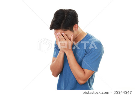 A grieving man A grieving man 35544547