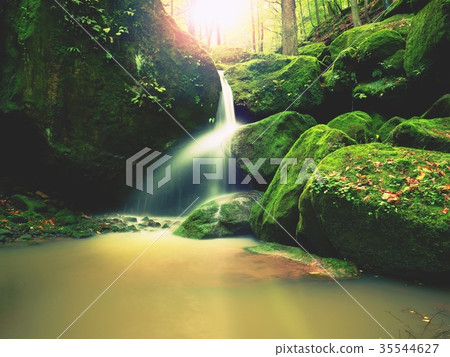 Rapids on small mountain stream. Blurred water Rapids on small mountain stream. Blurred water 35544627