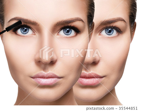 Woman applying mascara on eyelashes with brush. 35544851