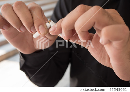 man quit smoking, breaking cigarette man quit smoking, breaking cigarette 35545061