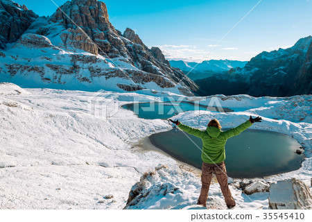 woman hiker on mountain trail woman hiker on mountain trail 35545410