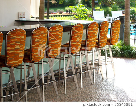 colorful coffee shop bar stools at long counter 35545891