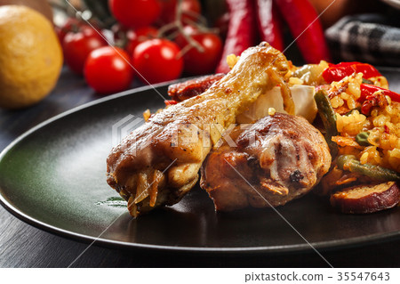 Traditional paella with chicken legs Traditional paella with chicken legs 35547643