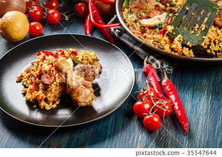 Traditional paella with chicken legs Traditional paella with chicken legs 35547644