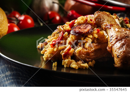 Traditional paella with chicken legs Traditional paella with chicken legs 35547645