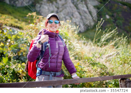 Female tourist in sunglasses against of 35547724