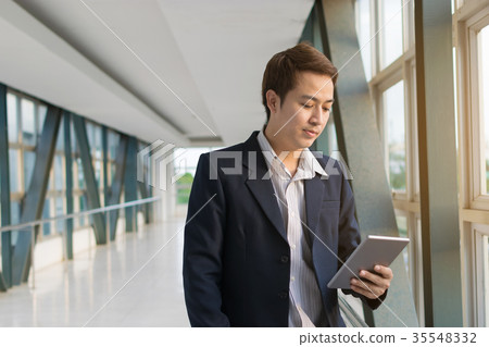 Businessman using a smartphone 35548332